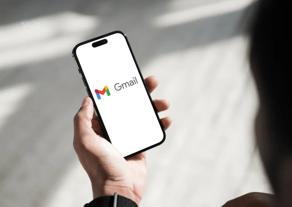 Person holding an Mobile phone which displaying Gmail